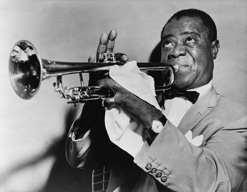Black and white portrait of Louis Armstrong, one of the most famous Black Americans