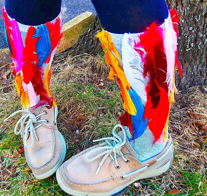 Socks covered in colorful feathers