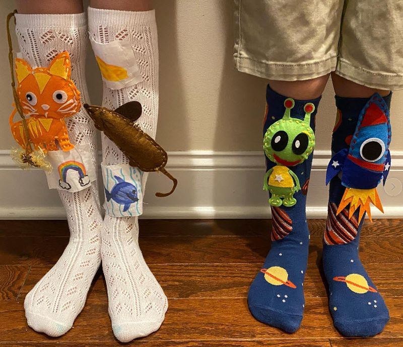 Tube socks with felt figures sewn to them
