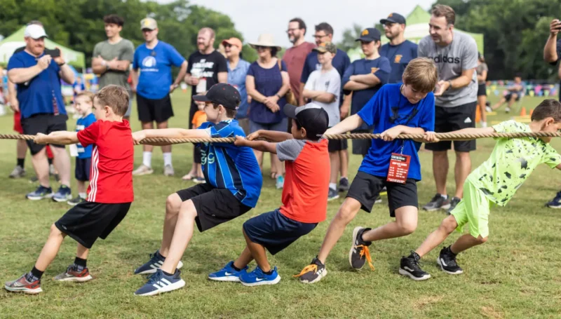 Boys holding a tug of war competition