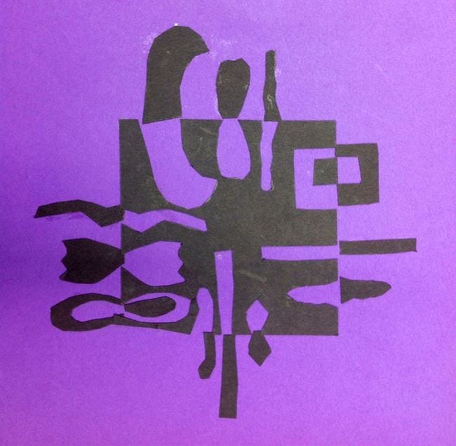 Abstract black shapes on purple paper