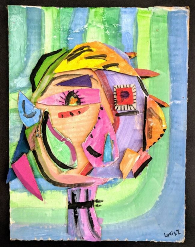Picasso-style portrait of a girl made with pieces of colorful cardboard