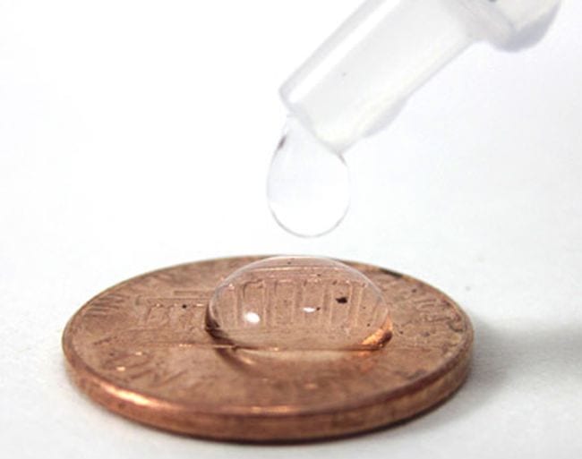Penny with a drop of water on it dripped from a pipette