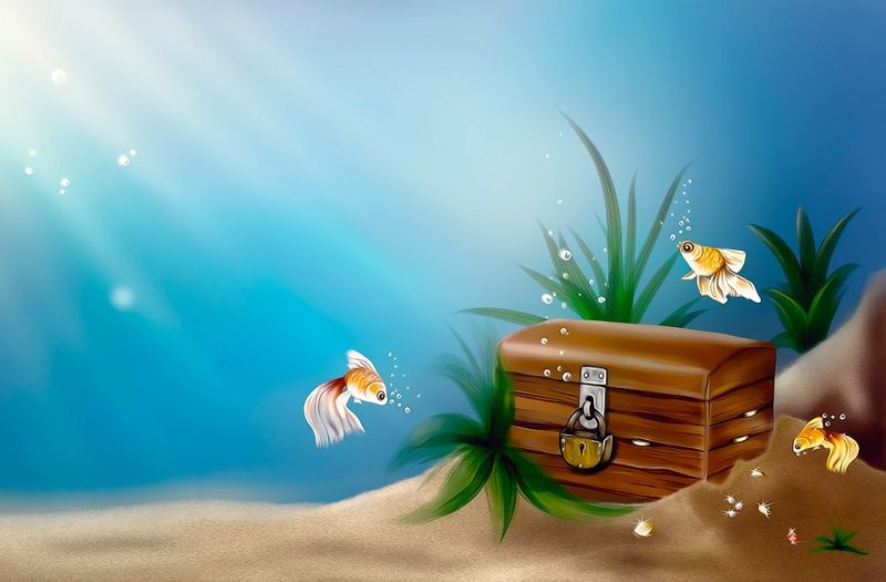 Goldfish swimming around a closed treasure chest sitting in the sand under the water