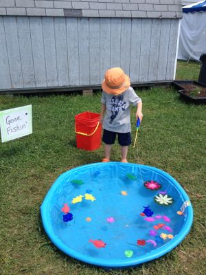 photo-of-kids-pretending-to-fish-in-a-backyard-pool