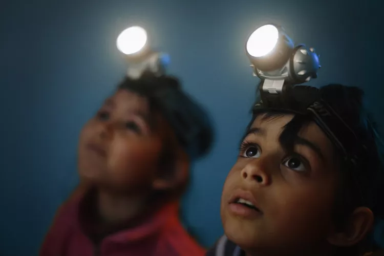 Kids using flashlights