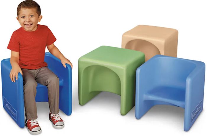 Toddler sitting on a 3-in-1 chair next to 3 others in various colors