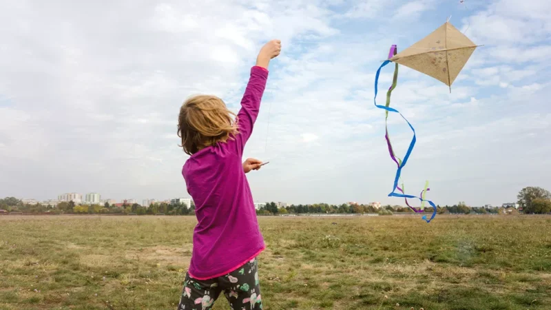 Fun last day of school activities- young girl flying a kite