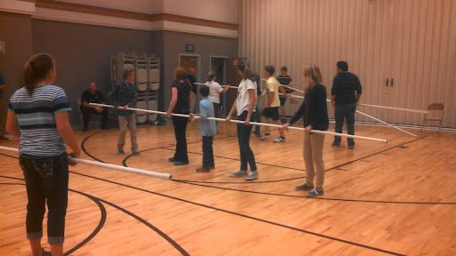 Students playing human-sized foosball