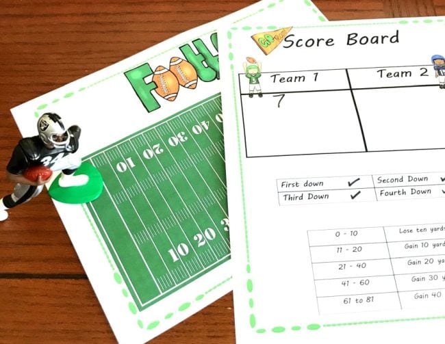 Printed paper football field with math worksheet describing the rules of the game