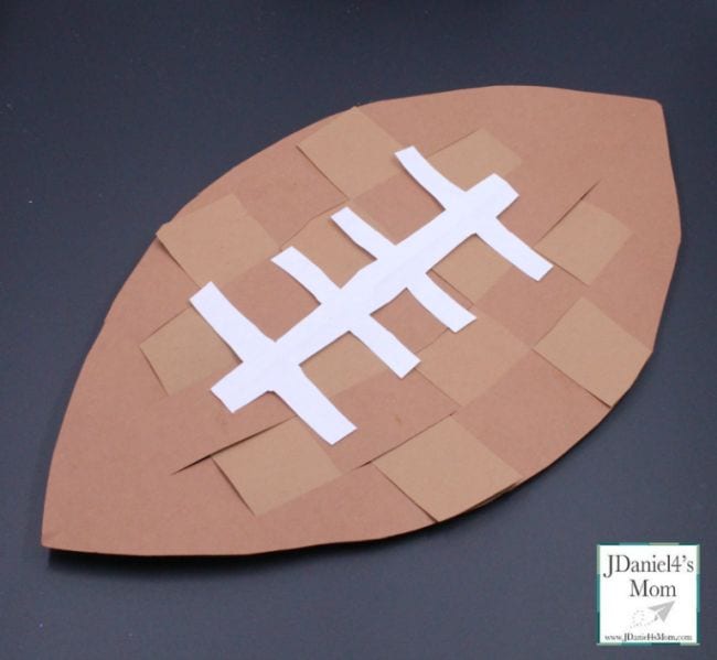 Football made of woven strips of brown construction paper
