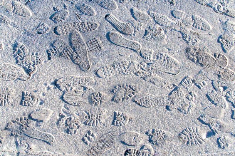 A series of random footprints in the snow