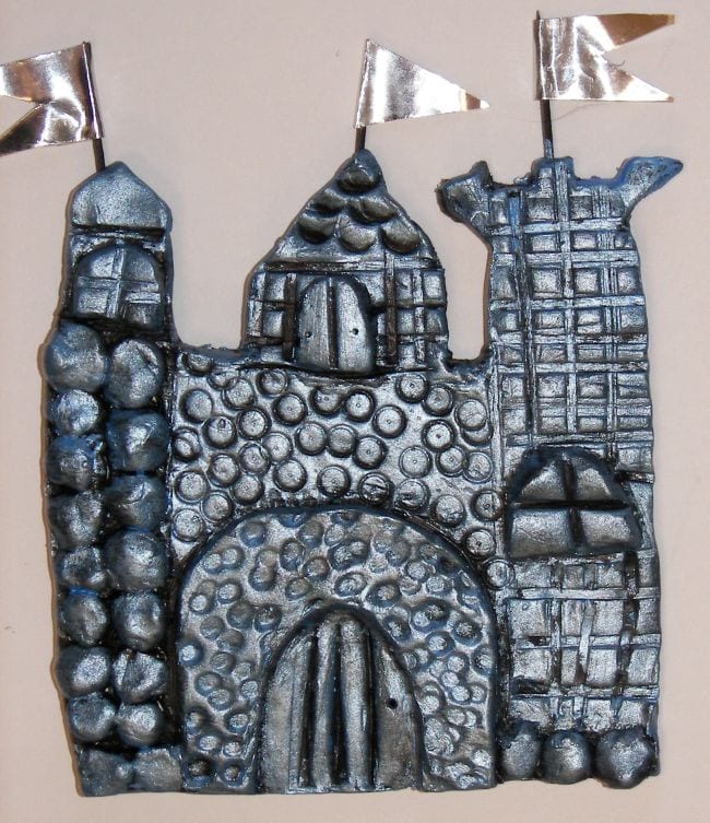 Flat castle made of textured clay painted silver