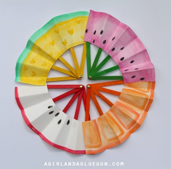 Colorful fans made from craft sticks and decorated paper form a circle