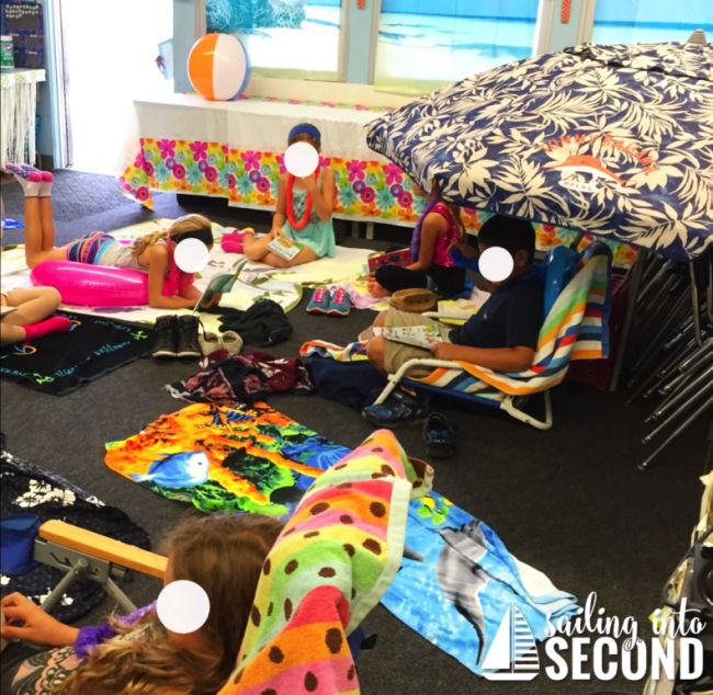 Students enjoying a classroom decorated to look like a beach