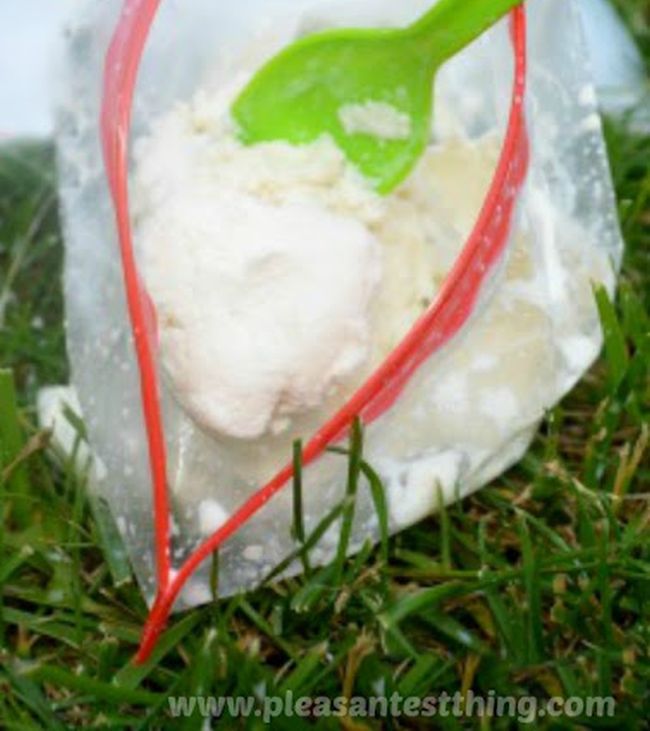 Ice cream in a ziploc bag with a green plastic spoon