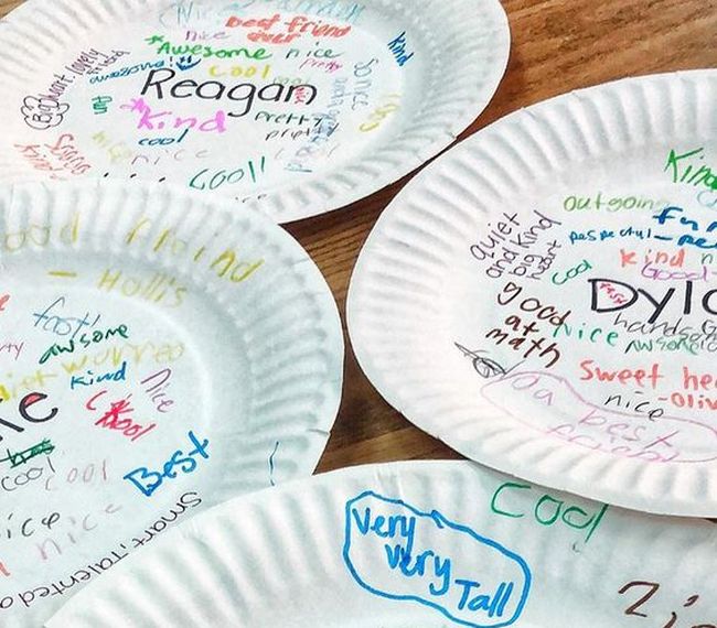 Paper plates covered in messages and signatures from classmates (Fun Last Day of School Activities)