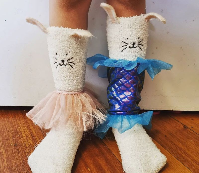 Fuzzy bunny slipper socks accessorized with tutus