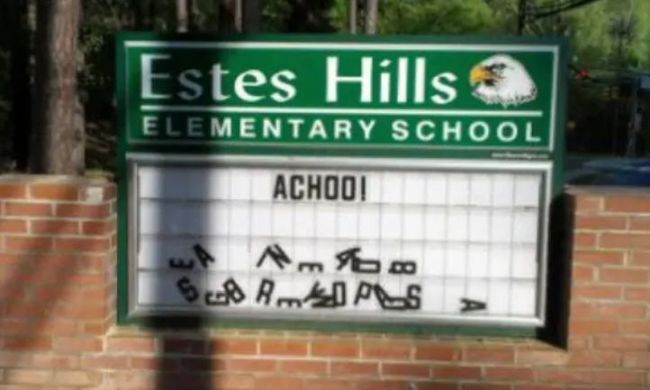 School marquee reading "Achoo!" with random letters scattered beneath