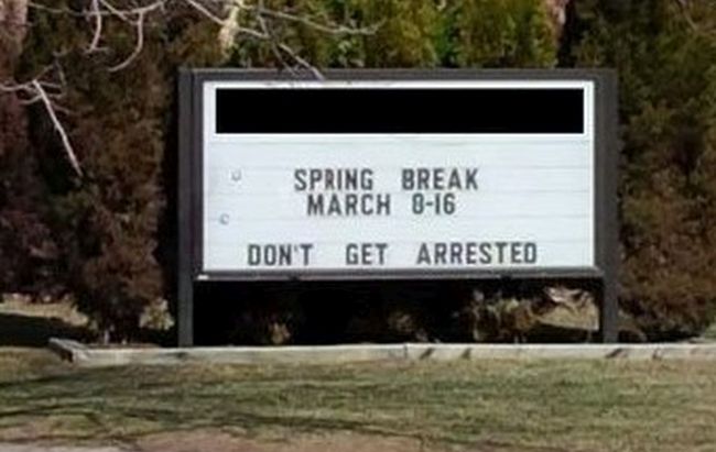 School marquee reading Spring Break March 8-16: Don't Get Arrested