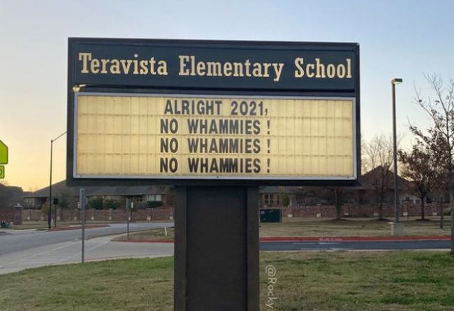 School marquee sign reading: "Alright, 2021: No Whammies! No Whammies! No Whammies!"