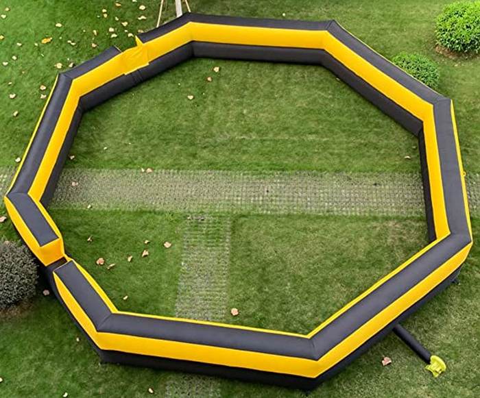 Yellow and black inflatable gaga ball pit seen from above