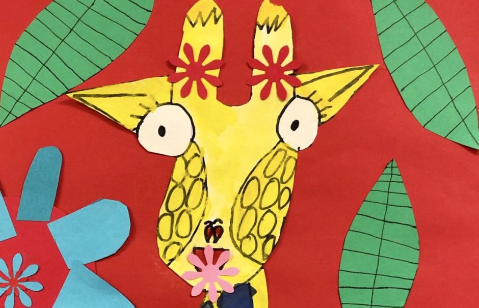 A construction paper giraffe is shown on a bright background.