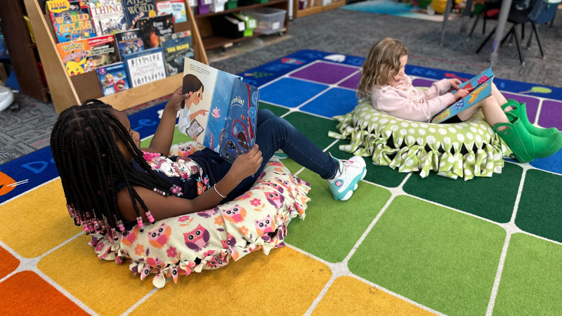 Girls reading in DIY reading chair