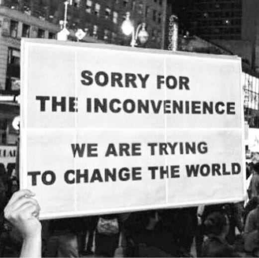 'Sorry for the inconvenience. We are all trying to change the world.' sign