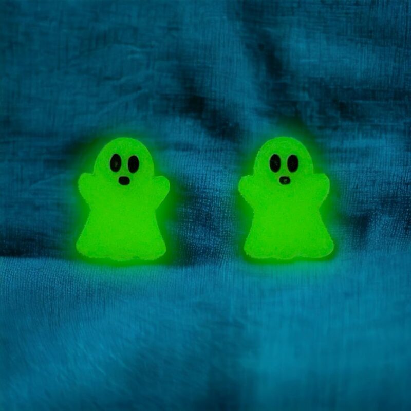 Glow in the dark ghost earrings glowing green.