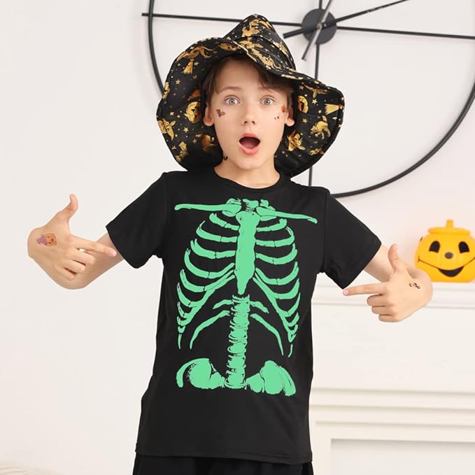 Some Halloween shirts glow in the dark like this one  with a skeleton on it that glows green. A little boy is pointing to the shirt.