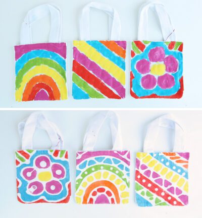 six small tote bags with brightly colored batik designs printed on them, as an example of summer crafts for kids