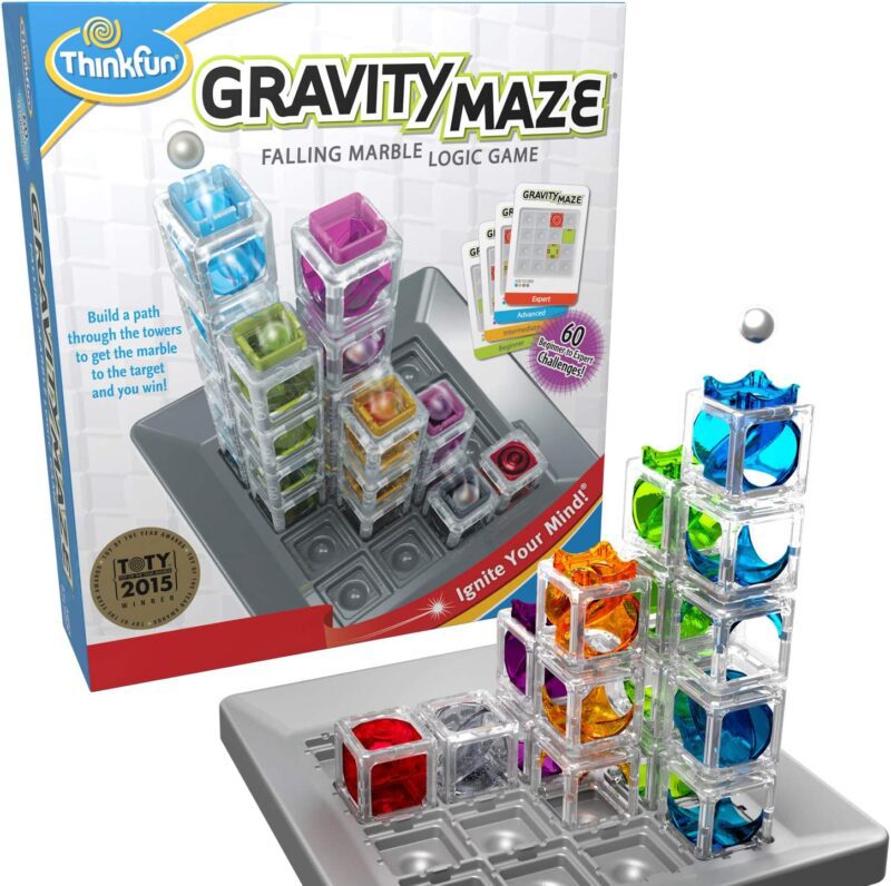 A box says Gravity Maze. It shows a gameboard with ice cube looking blocks in the shape of a 3D maze. (educational board games)