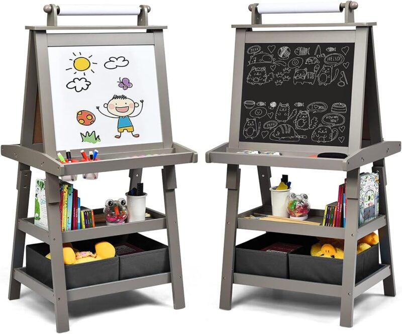 Two gray easels are shown. One with the whiteboard side facing out and the other with the chalkboard. Paper rolls are on the top and there is a lot of storage on the bottom.