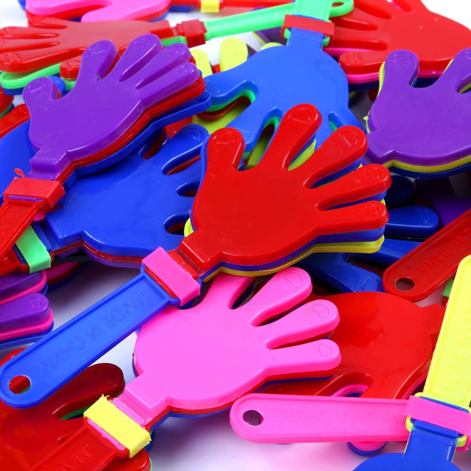 Pile of colorful plastic hand clappers.
