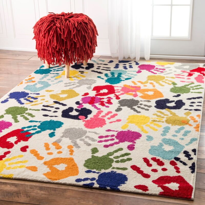 Classroom rugs can be brightly colored like this one with designs of colorful handprints on it.