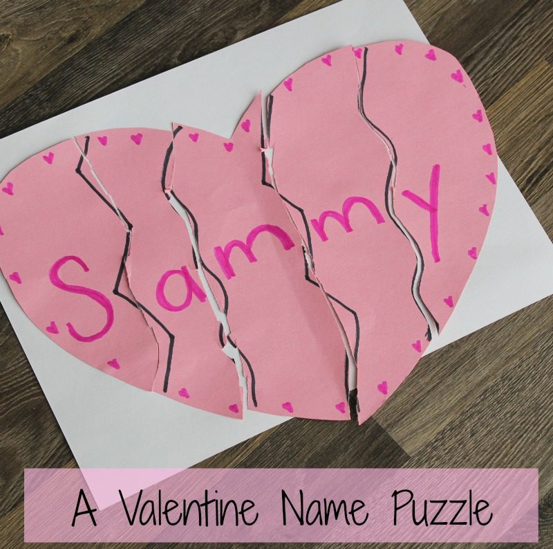A pink heart is broken into 5 pieces to form a puzzle that spells Sammy (Valentine's Day Crafts for Preschoolers)