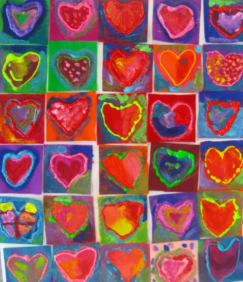 A colorful collage of 30 individually made heart paintings as an example of school auction art projects