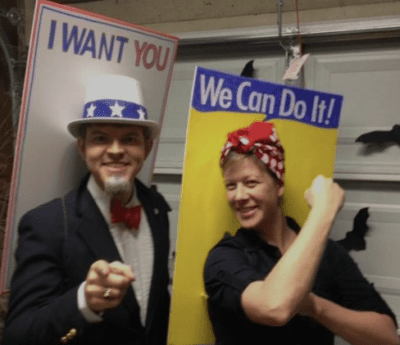 Teacher Halloween costumes include this one which shows a man dressed as Uncle Sam and wearing a tall hat. He is standing behind a poster that says I want you. A woman is shown with her hair in a red and white polka dot bandana making a muscle with her arm. She is standing in front of a poster that says We Can Do It.