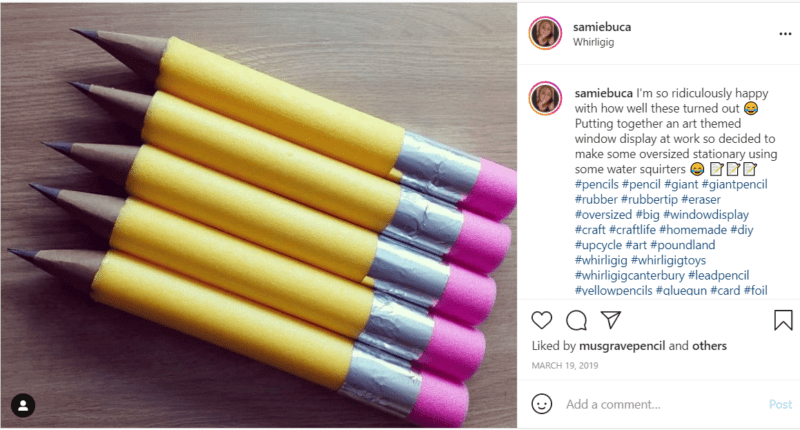 Giant yellow pool noodle pencils lined up in the classroom