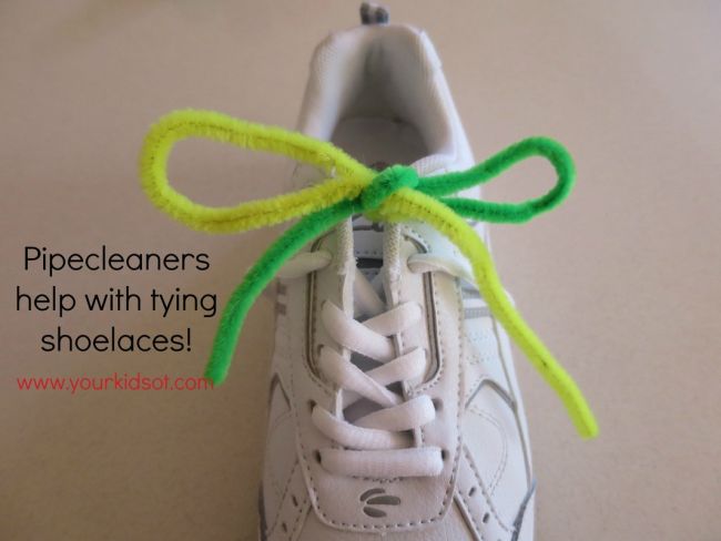 Tennis shoe with green and yellow pipe cleaners forming a bow. Text reads Pipecleaners help with tying shoelaces!