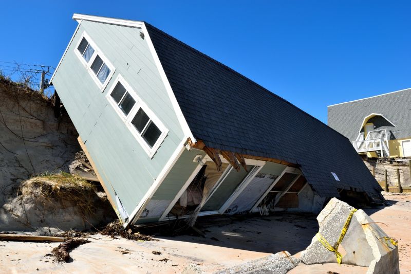 House tipped on its side following a hurricane