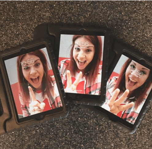 Three devices have photos of a woman making different faces on them.