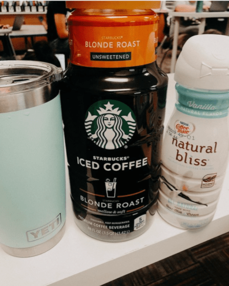 A Starbucks ice coffee mix and a tumbler are shown.