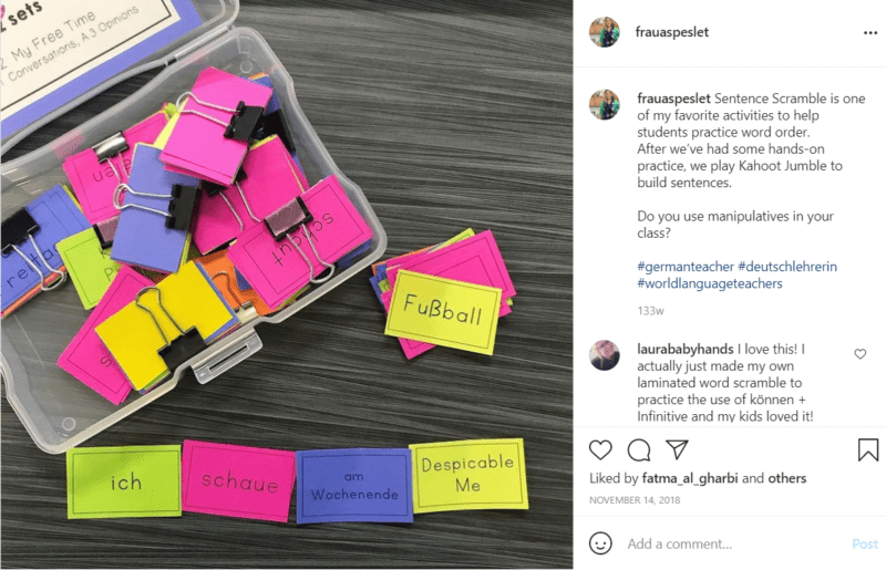 Plastic case containing colorful sentence scramble pieces on desk in German classroom
