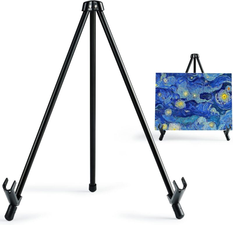 A close-up of a metal tripod display easel is shown. In the background Van Gogh's Starry Night is on display in this example of an art easel for kids.