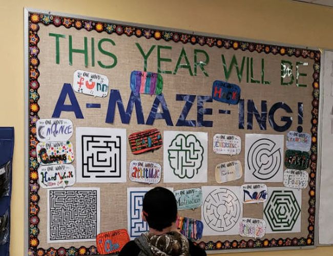 Bulletin board titled This Year Will Be A-Maze-ing with various mazes for students to solve