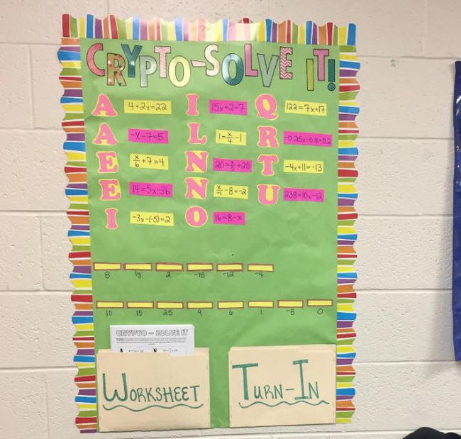 Bulletin board called Crypto Solve It with equations to solve to learn the correct letters of a coded phrase