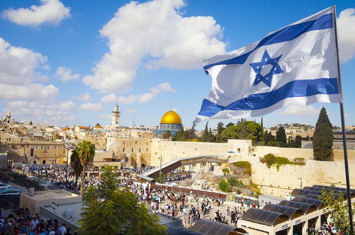 Israel flag with a view of old city Jerusalem and the KOTEL- Western wall, as an example of summer professional development for teachers