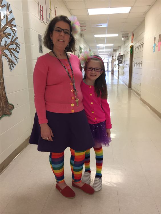 Book character costume ideaslike this one shows a teacher and a little girl are wearing matching outfits that include a hot pink cardigan, purple skirts, and rainbow knee highs.